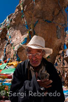 A pilgrim with twin stones Nam-tso Lake, surrounded by hundreds of prayer flags. Nam Tso Lake was generated due to the movements of the Himalayas. The meadows surrounding it are rich in herbs, which makes them perfect natural grass. At the beginning of every summer, wild ducks move there group after group. Around the lake live bears, wild oxen and donkeys, sheep, blue foxes, marmots and other wildlife.