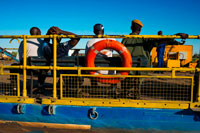 Ferry to cross the Chobe River. From Victoria Falls is possible to visit the nearby Botswana. Specifically Chobe National Park.  Chobe, which is the second largest national park in Botswana, covers 10 566 square kilometres. The park is divided into four main focal points comprising the Chobe River front with floodplain and teak forest, the Savute Marsh in the west about fifty kilometres north of Mababe gate, the Linyanti Swamps in the northwest and the hot dry hinterland in between. The original inhabitants of what is now the park were the San people, otherwise known in Botswana as the Basarwa. They were hunter-gatherers who lived by moving from one area to another in search of water, wild fruits and wild animals. The San were later joined by groups of the Basubiya people and later still, around 1911, by a group of Batawana led by Sekgoma. When the country was divided into various land tenure systems, late last century and early this century, the larger part of the area that is now the national park, was classified as crown land. In 1931 the idea of creating a national park in the area was first mooted, in order to protect the wildlife from extinction and to attract visitors. In 1932, an area of some 24 000 square kilometres in the Chobe district was declared a non-hunting area and the following year, the protected area was increased to 31 600 square kilometres. However, heavy tsetse fly infestations resulted in the whole idea lapsing in 1943. 