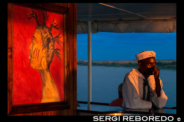 Cruise along the Victoria Falls aboard the " African Queen". Relax and enjoy our African Sunsets from our upmarket cruise boats… “A river of enchantment and magical colours bursting in the sky creating nature’s own masterpiece”, is the only way to describe the African Sunset on the Mighty Zambezi. Cruise along the banks of the river, and view the spectacular scenery that is nature’s own sanctuary, and home to the “laughing hippos”, the “singing birds” and the “snapping crocodiles”, as you sip on your drink and indulge on mouthwatering snacks. Enjoy the hospitality of our professional guide and Captain as you relax and enjoy the delicious snacks and chilled refreshments. See the “smoke that thunders” as you gently cruise the upper Zambezi River. Enjoy the myths and legends as our guide shares tales of the local tribes. Experience the Zambezi River as David Livingstone did and travel through waters once journeyed by him on his way to the Victoria Falls. Observe the aquatic bird life and other resident or migratory species. You may be fortunate enough to witness the great African elephant swimming from island to island, grazing or dusting themselves on the riverbanks. The Zambezi sunset is a highlight of the trip and captivates your magical experience on the Zambezi River. 