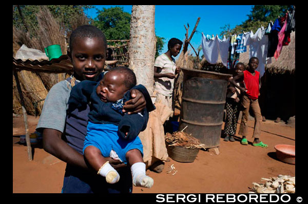 Inhabitants of Mukuna Village. In the Kazungula District of Southern Province lies the rural Mukuni Village. It is just seven kilometres from the world heritage site of Victoria Falls and was founded in the thirteenth century by Bedyango the Leya Tribal Matriach, it was originally called Gundu. However it was renamed in the seventeenth century to Mukuni Village after and in honour of Mukokalya Mukuni N’gombe. Mukuni Village is sitauted on a dry, sandy knoll and has a population in excess of 7000, it is the main village of the Mukuni Chiefdom. The soil is relatively infertile and they cannot rely on agriculture; therefore they have turned to tourism. Mukuni Village is now a tourist destination, introducing an insight into the Leya people’s cultural inheritance; with a wonderful developing curios market, selling intricate wood carvings, stoneware, jewellery and baskets. There are over 100 villages within the Mukuni Chiefdom, with twelve schools and three health centres at Mukuni, Songwe and Katapazi.  July 2013 saw the completion of a fourth clinic at Mahalululu. Mukuni high school and the special education unit, both funded by The Butterfly Tree, were the first rural schools in the district. WE have advanced a number of schools by adding classrooms and bore holes and built an entire new school at Mailami. We work in partnership with the Mukuni Development Trust, which takes care of the Chiefdom’s administration to assist the people.