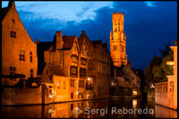 Bruges. Bruges at night with the Belfry in the background, the most tipical landscape in Bruges. Evening view over Bruges : the Dijver canal and the Belfry tower.