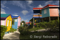 Houses decorated with bright colors typical of Junkanoo. Compass Point, Nassau.