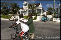 Children at home and bike loyalist. Dunmore Town Bay St. - Harbor Island, Eleuthera.