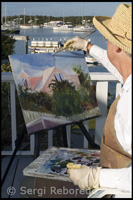 Painter, painting the Port Hope Town - Elbow Cay - Abacos.