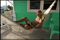 Typical house loyalist - Resting in a hammock. Hope Town - Elbow Cay - Abacos. Bahamas