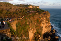 Tourists along the cliffs near the temple Pura Ulu WATU Luhur. Bali.