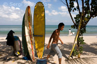 Rent a surfboard on the beach of Kuta. Bali.