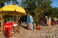 Rent a surfboard and bar drinks on the beach of Kuta. Bali.