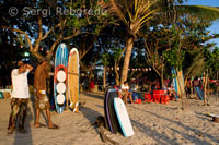 Rent a surfboard and bar drinks on the sandy beach of Kuta. Bali.