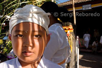 Portrait of a child in a Hindu temple near Kuta. Bali.
