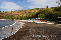 Boats resting on the sandy beach of Amed, a fisherman village of East Bali.