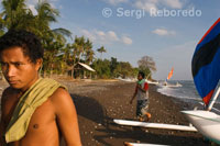 Some fishermen take their boats to the shore near the beach in Amed, a fishing village in East Bali.