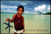Girl with a starfish. White beach. Boracay.