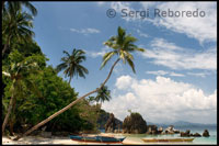 Several boats in the Moorings of the island of white sand Pangulasian. Palawan.