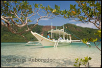 A boat mooring on the white sands of the Snake Island. Palawan when the tide is low.