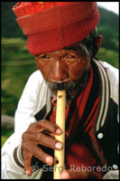 Ifugao playing the flute. Rice Terraces. Banaue. Northern Luzon.