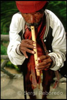 The tribe inhabiting northern Luzon Ifugao says. An Ifugao playing the flute. Rice Terraces. Banaue. Northern Luzon. 